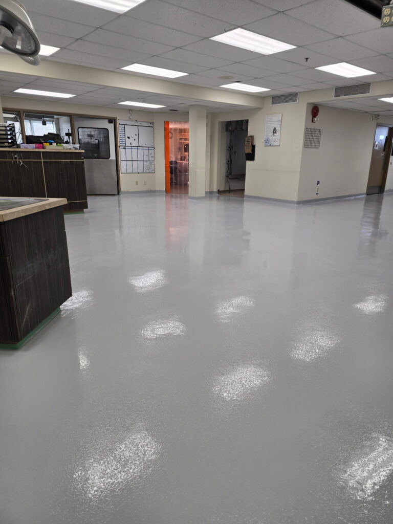 Commercial epoxy flooring with non-slip traction coating installed in a commercial facility in Calgary
