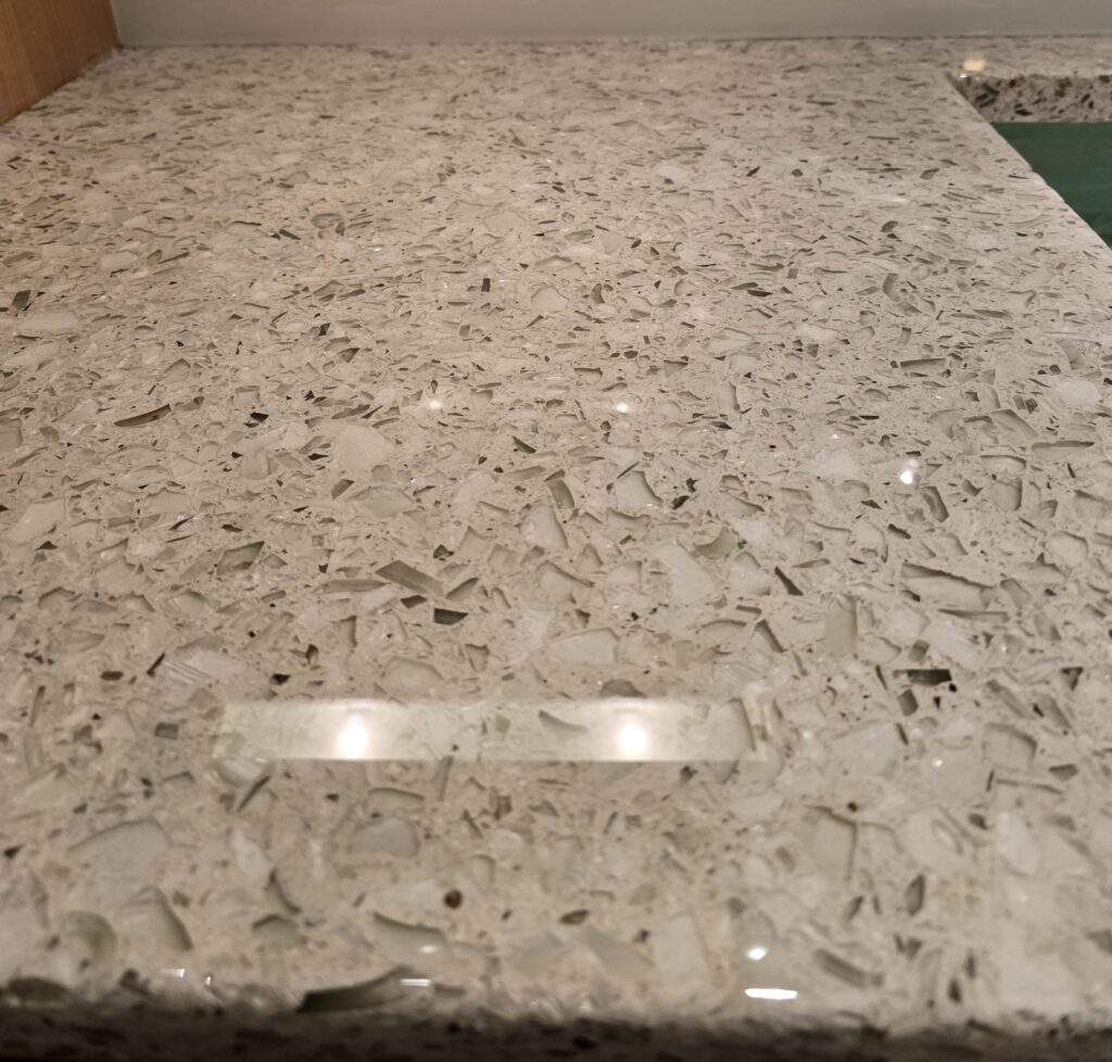 Textured rock stone look epoxy countertop refinishing with embedded stone aggregate chips